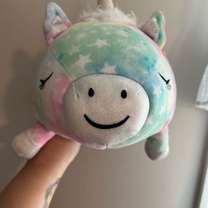 Squishmallow by Justice laying unicorn hugmee